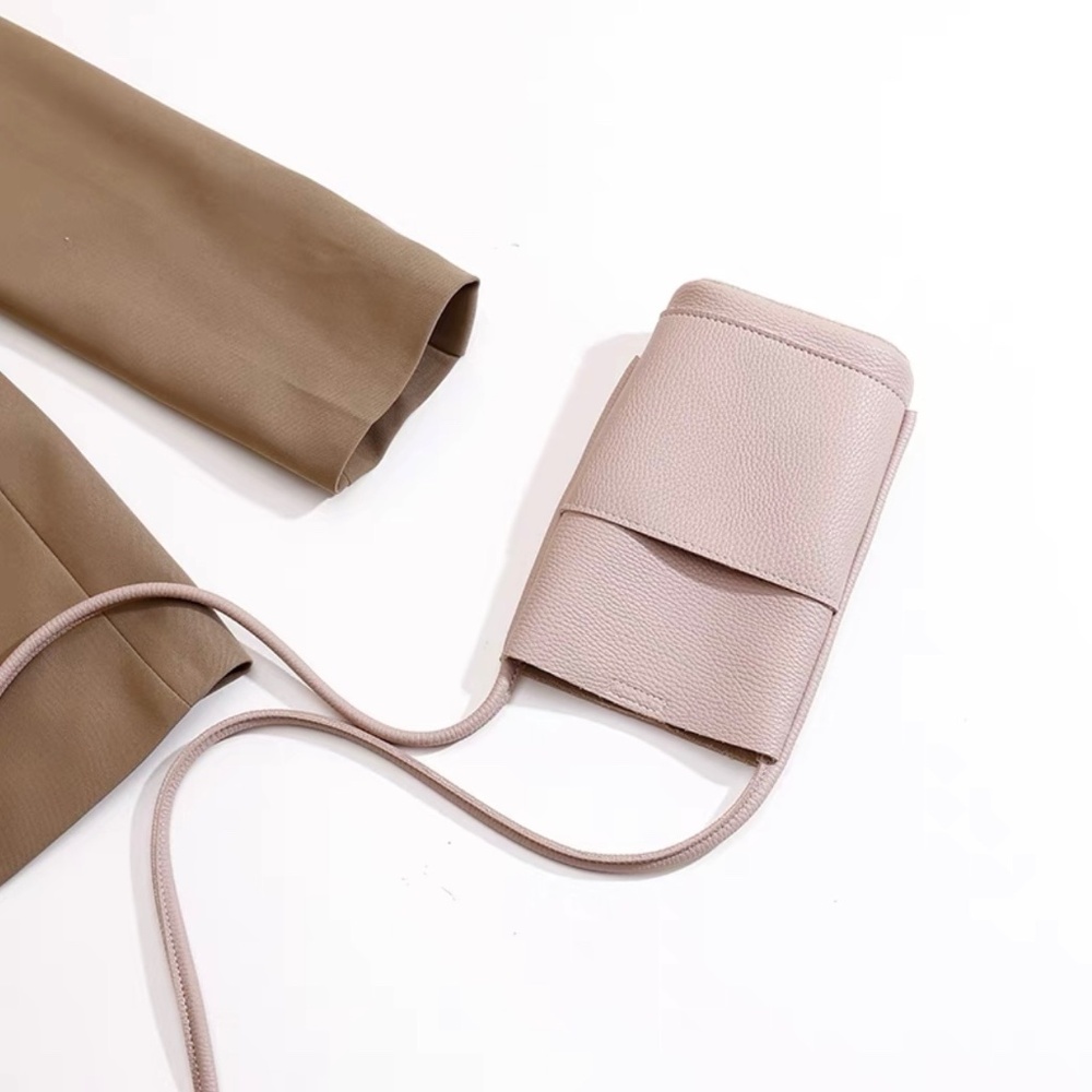 NWOT. Cell Phone Crossbody Bag. Color: Light pink.